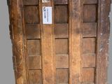 an old wooden crate with a tag on it sitting on a table