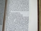 an open book with writing on it sitting on a table