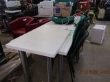a table with a backpack on top of it in a warehouse