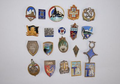several different types of badges are displayed on a white surface