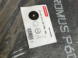 a plastic bag with a sticker on it sitting on a table