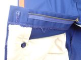 a close up of a blue jacket with a zipper on it