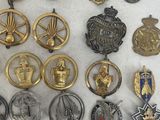 many different types of badges on a white surface