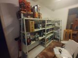 a room that has a lot of boxes on the shelves