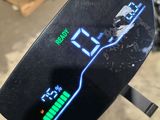 a close up of a motorcycle with a digital display on it