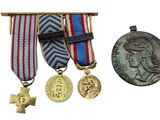 two medals and a medal on a white background with a cross