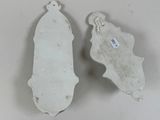 two pieces of metal with a tag on them