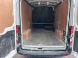a white van that is parked in a parking lot