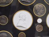 a picture of a display case with a lot of coins
