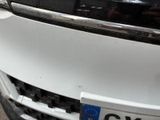 a close up of the front of a car with a license plate on it
