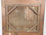 an old wooden picture frame with a picture of a man on it