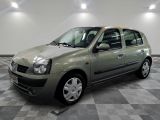 a picture of a small green car parked in a garage