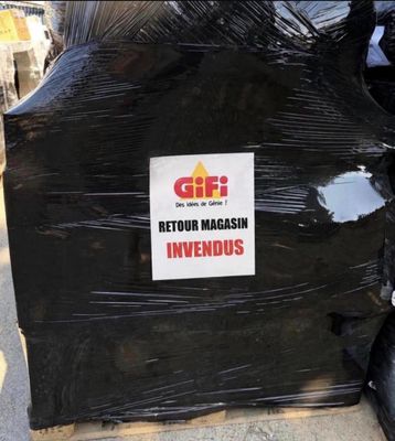 a pile of garbage sitting on the side of the road