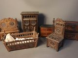 four pieces of furniture that are sitting on a table