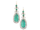 a pair of emerald and diamond earrings