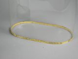 a yellow bracelet that is in a clear glass container