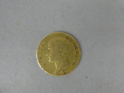 a gold coin with a picture of a woman ' s face on it
