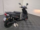 a scooter that is parked in a room