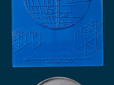 a star wars coin sitting next to a star wars coin