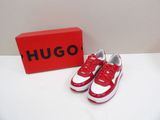 red and white sneakers with a red box on a white surface