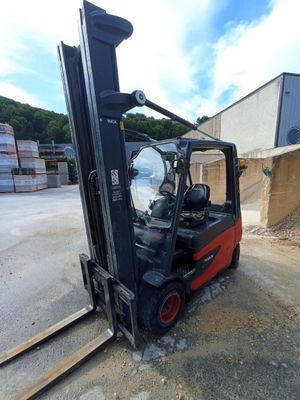 a forklift that is sitting in the middle of the road