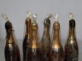 six bottles of beer are lined up in a row on a table
