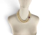 pearl and ruby necklace on mannequin head