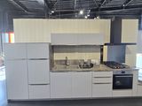 a kitchen with a stove, sink, oven and refrigerator