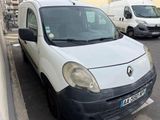 a white van that is parked on the side of the street
