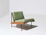 an image of a green chair in a white room