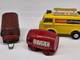 three toy vehicles that are sitting next to each other