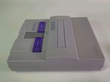 two nintendo classic game consoles sitting side by side on a white surface