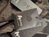 two tags attached to the back of a jacket