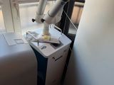 a room with a bed and a machine in it