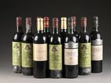 six bottles of wine are lined up in a row on a table