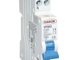 a close up of a miniature circuit breaker on a white background