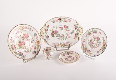 a group of plates and bowls with flowers on them