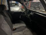 a car that is sitting in the back seat of a truck