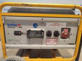 an image of a yellow portable generator sitting on top of a pallet