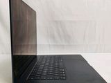 an open laptop computer sitting on top of a white surface