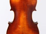 an old violin with a wooden back and a long neck