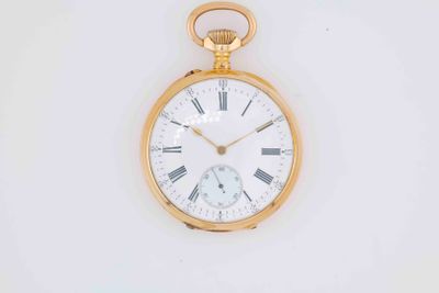 a gold pocket watch with roman numerals on the face