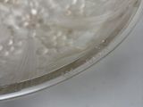 a glass bowl that has some white flowers in it