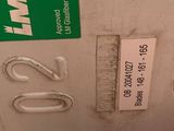 a close up of a metal object with a green label on it