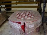 a pallet with a bunch of cans on it in a warehouse