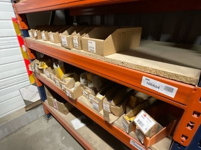 many boxes on the shelves in the warehouse