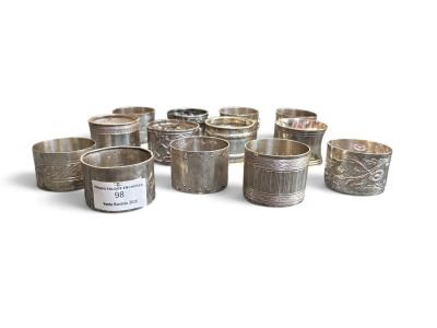 a lot of silver cups sitting on a white surface