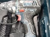 a drill that is sitting inside of a tool box