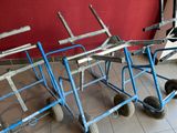 three hand trucks that are sitting on the floor