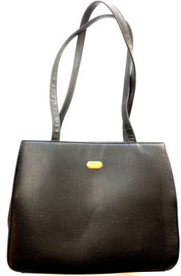 black leather handbag with a yellow handle on a white background